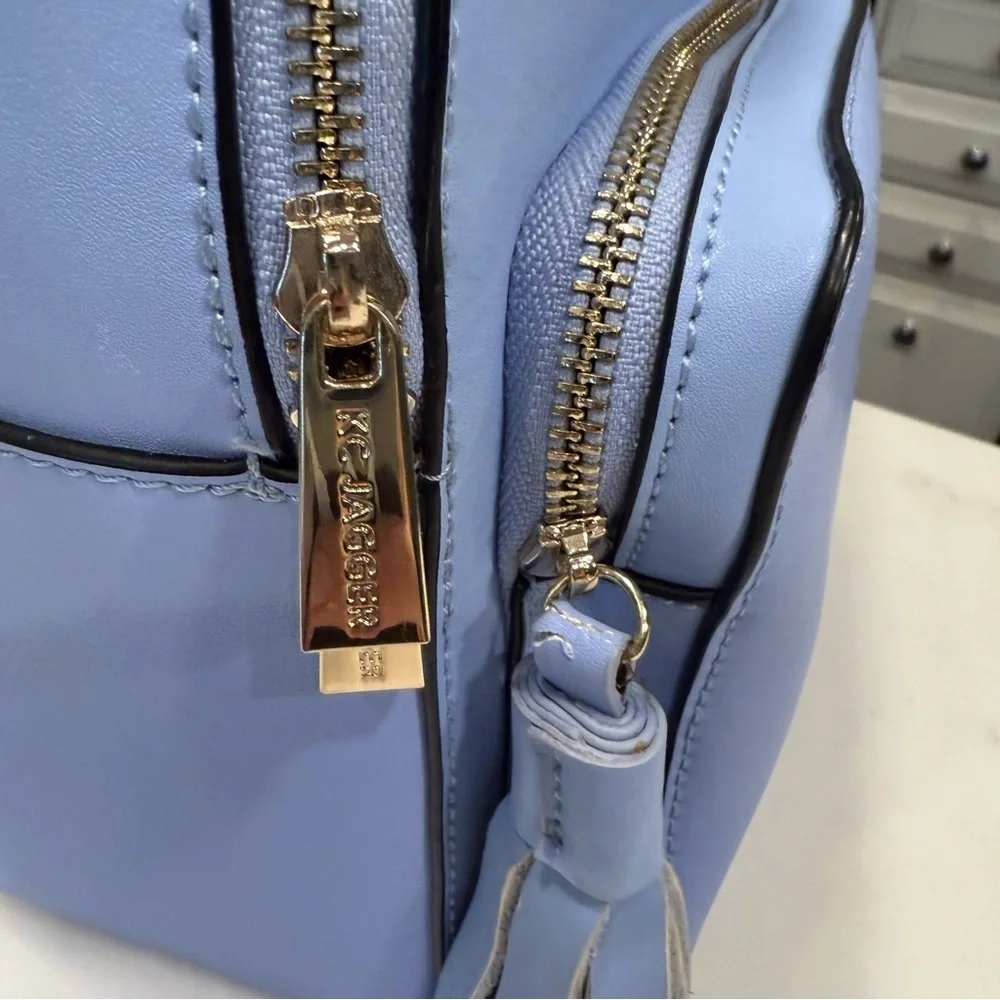 KC JAGGER Women’s Periwinkle Blue Leather Backpack, Front Zip Pocket Tassel